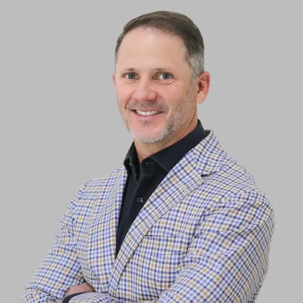 Dr. Charles Maupin, dentist at Lubbock dental practice, smiling in professional portrait.