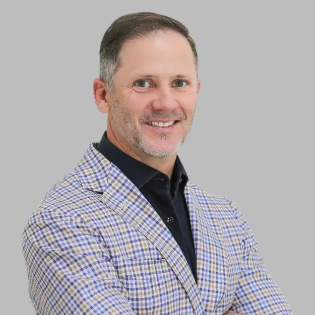 Dr. Charles Maupin, dentist at Lubbock dental practice, smiling in professional portrait.