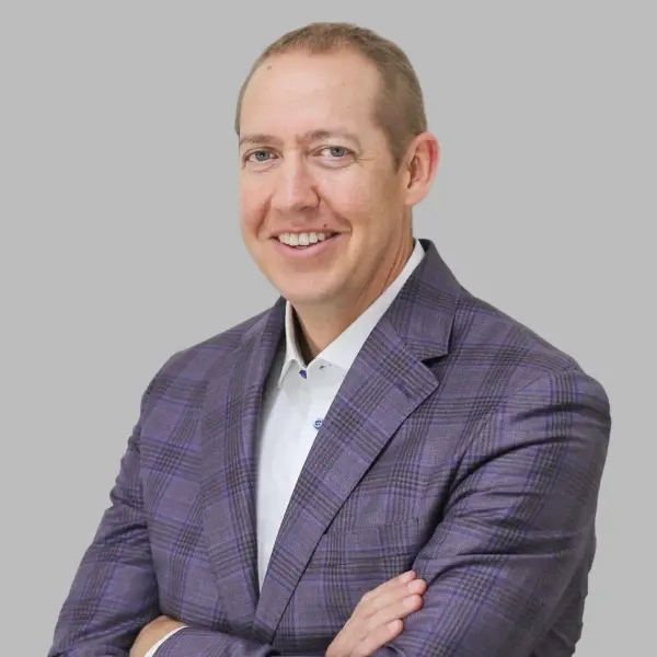 Dr. Chris Steffensen, dentist at Lubbock dental practice, smiling in professional portrait.