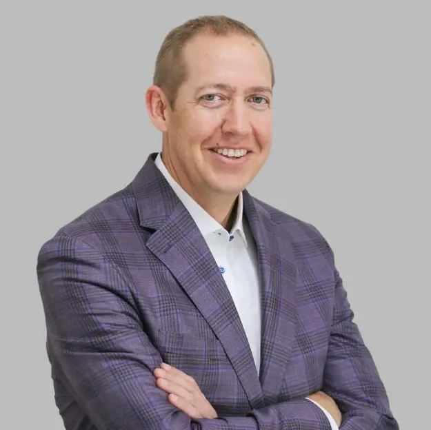 Dr. Chris Steffensen, dentist at Lubbock dental practice, smiling in professional portrait.