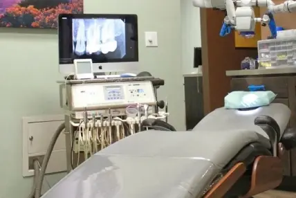 Modern dental treatment room with digital imaging equipment and patient chair at Lubbock dental practice.